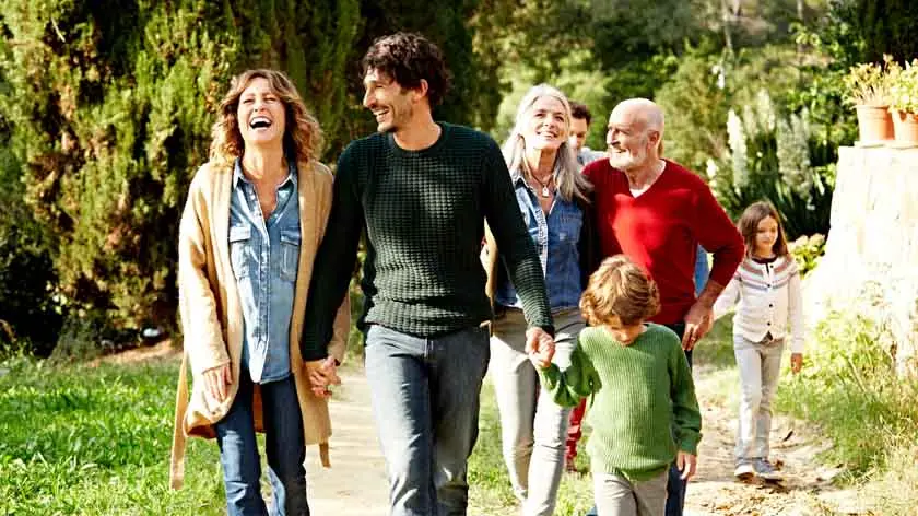 Happy family walking outside