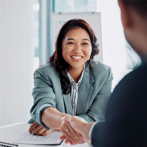 Woman shaking hands with her financial advisor