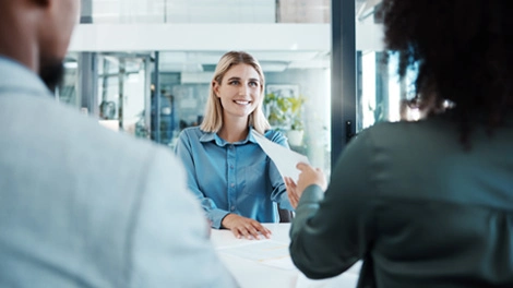 Couple meeting with their financial advisor in the advisor’s office