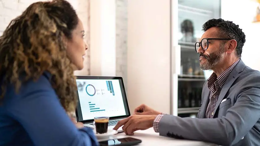 Two people looking at stocks