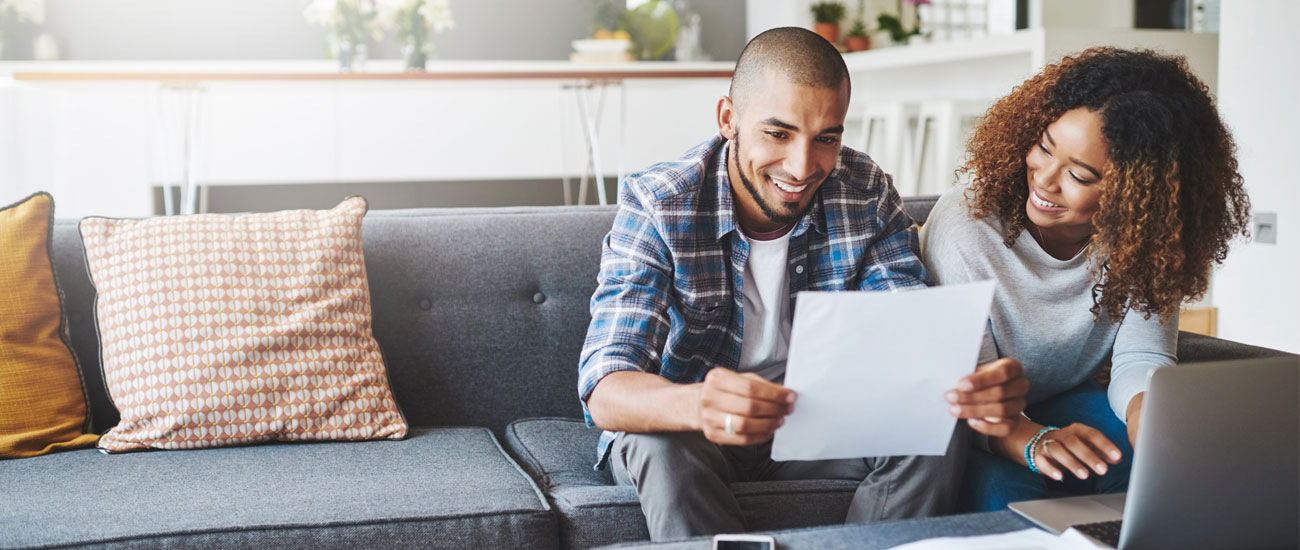 A couple looking at financial paperwork together