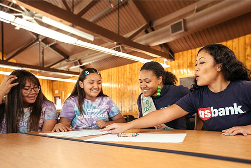  U.S. Bank community volunteer works with young women at camp