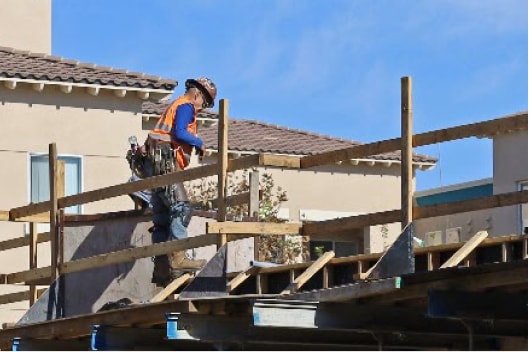 Construction workers at a Century Housing development
