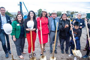 photo of people with shovels at a groundbreaking event