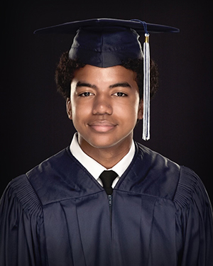 Young man wearing a graduation cap and gown