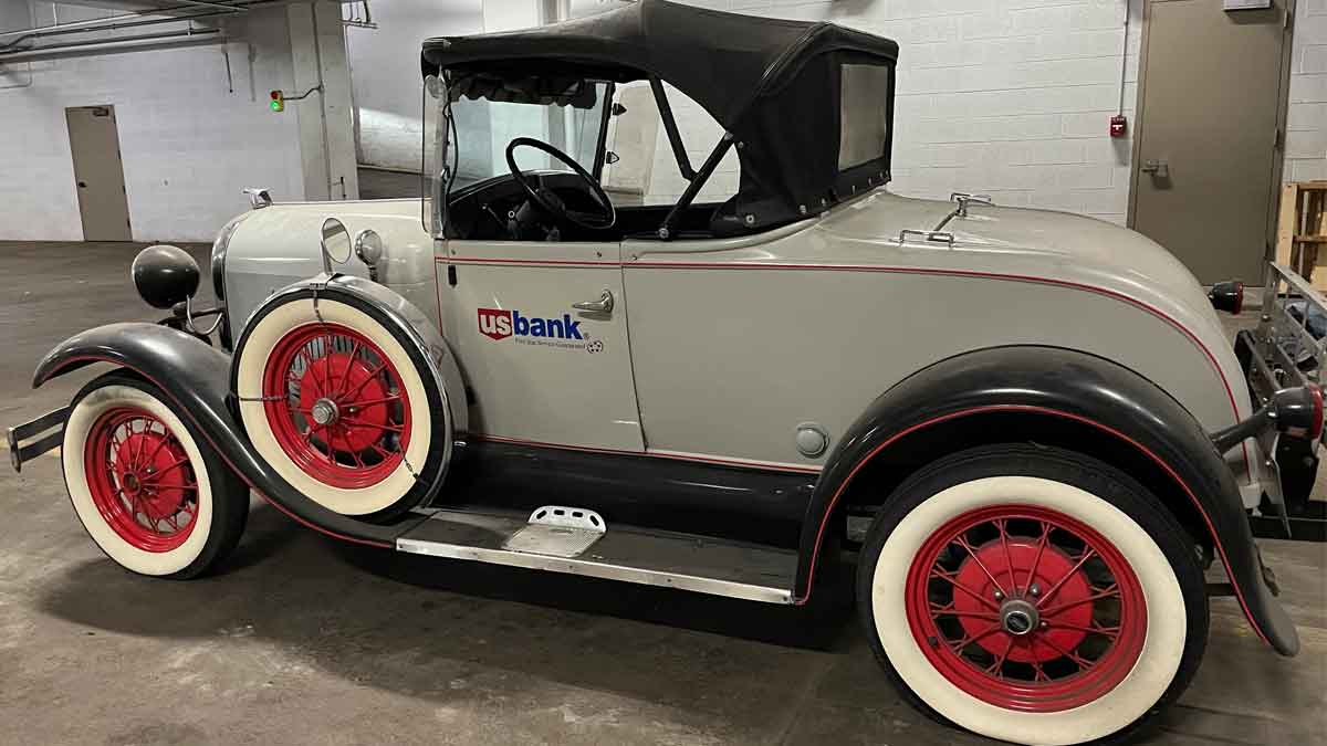 Image showing 1980s replica of the Model A vehicle in the lower level of a U.S. Bank building. 