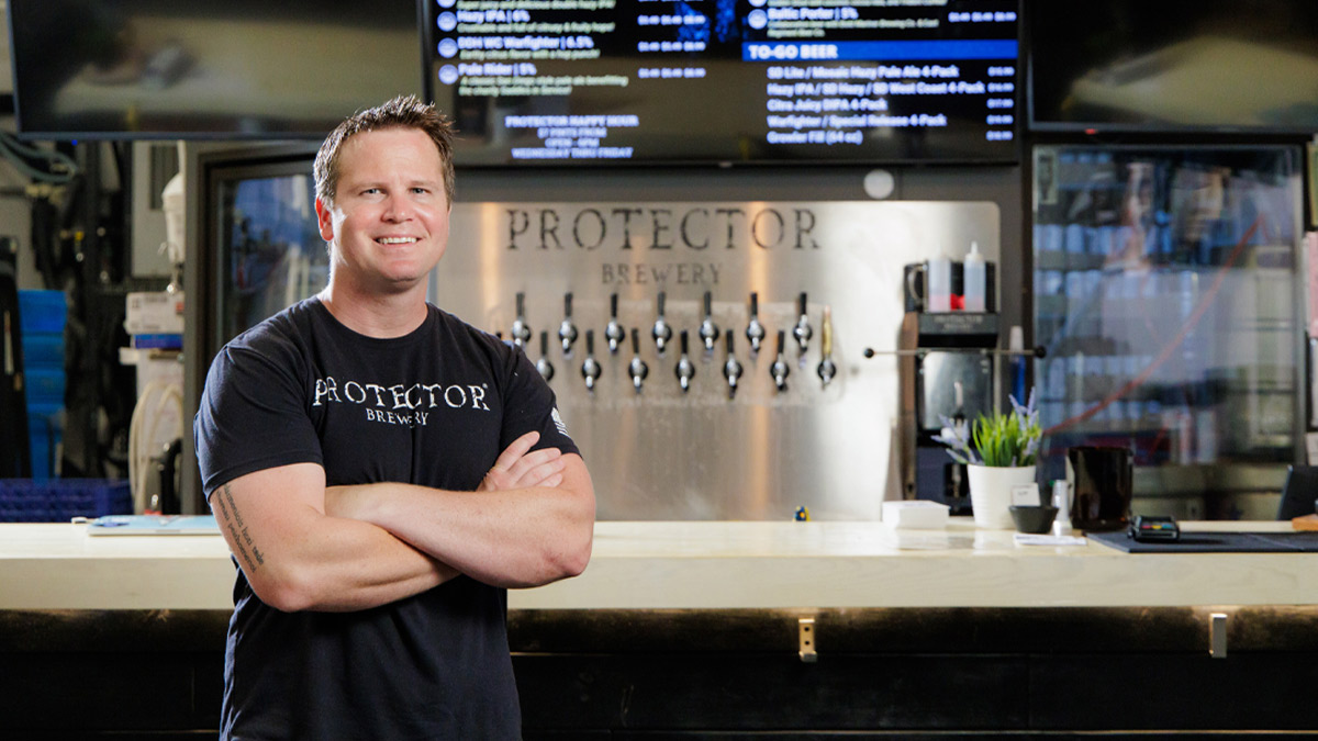 Brewery owner Sean Haggerty standing in front of the tasting room bar