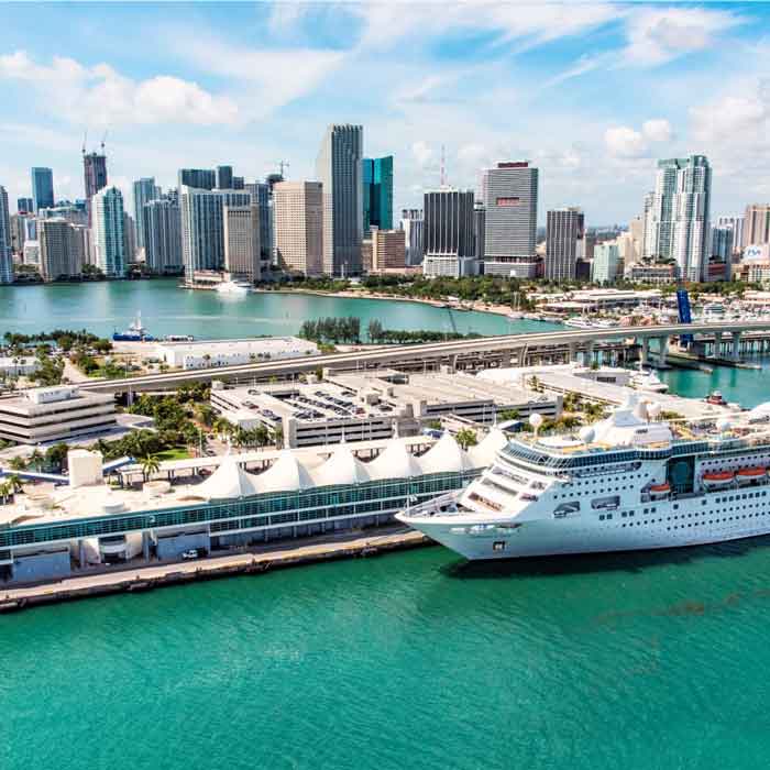 Image of the Miami skyline and showing a cruise ship in the harbor.