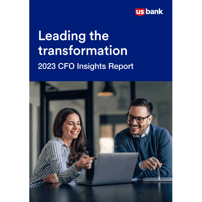 IMage featuring the cover of this year’s CFO report, which shows a man and woman sitting together at in an office and looking at a laptop.