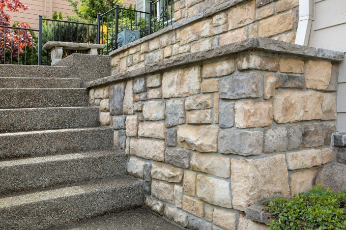 Stone wall and steps outside of a house