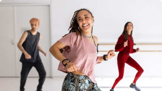 Lifestyle image of woman in a dance studio with friends
